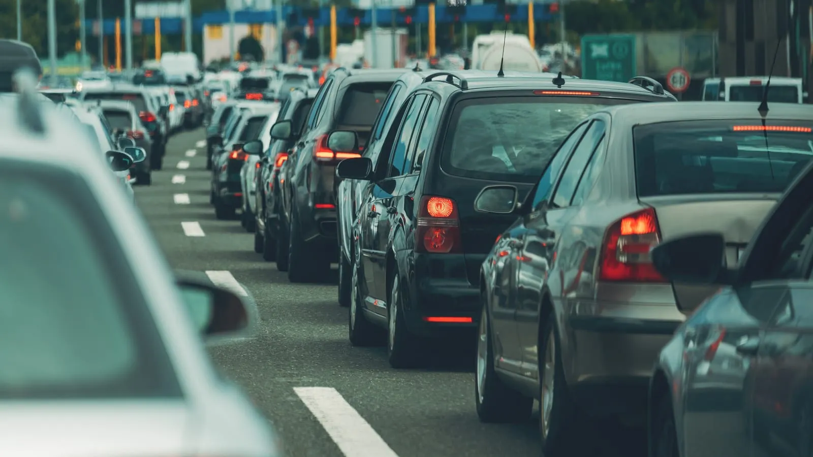 A long queue of cars backed up on a multi-lane motorway